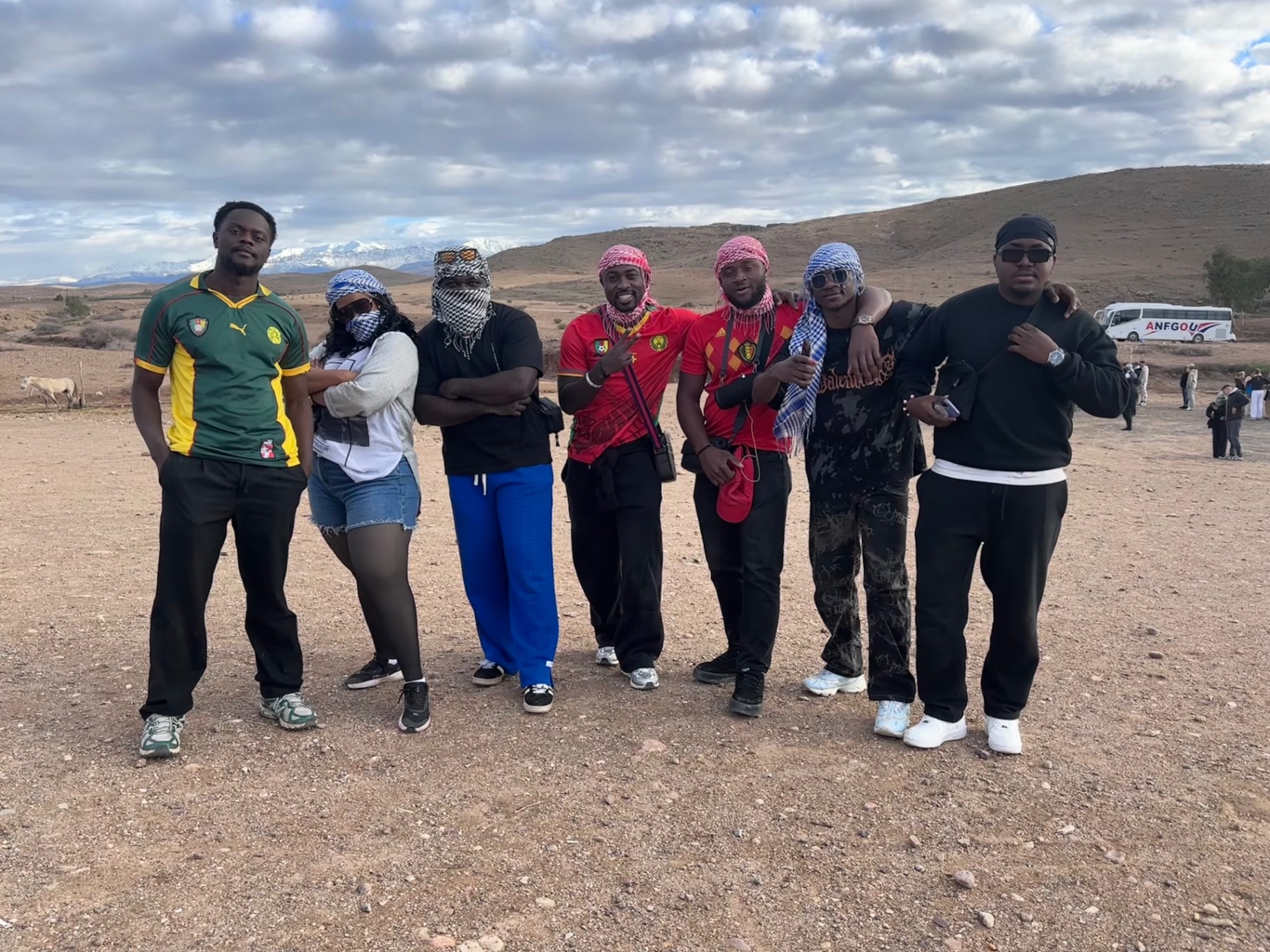 Friends posing together on a desert outing in Morocco