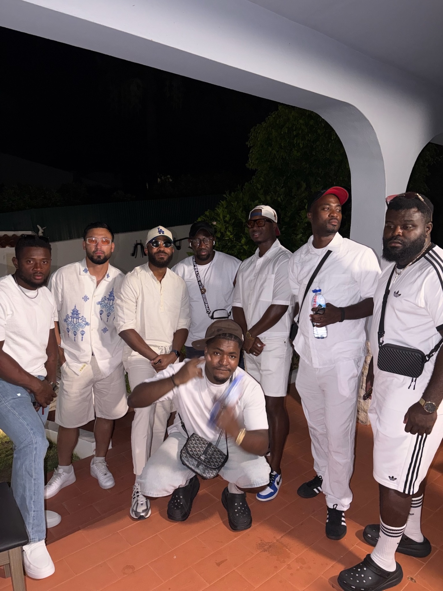 Friends dressed in white for an evening together